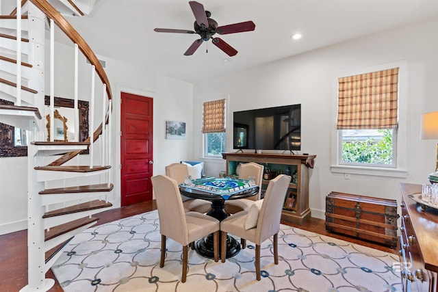 dining area with wood finished floors, baseboards, recessed lighting, ceiling fan, and stairs