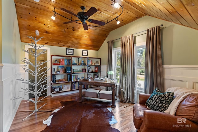 home office with lofted ceiling, wood ceiling, wood finished floors, and wainscoting