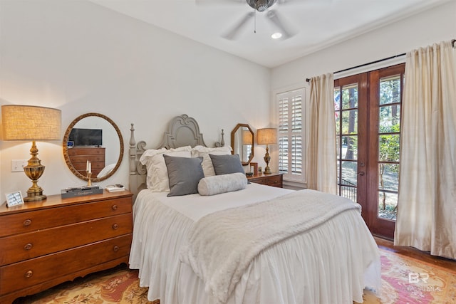 bedroom featuring access to exterior, light wood-type flooring, and ceiling fan