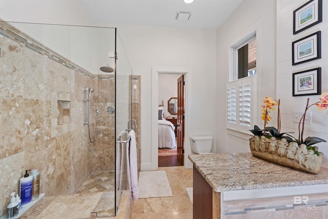 full bath featuring connected bathroom, tiled shower, and visible vents