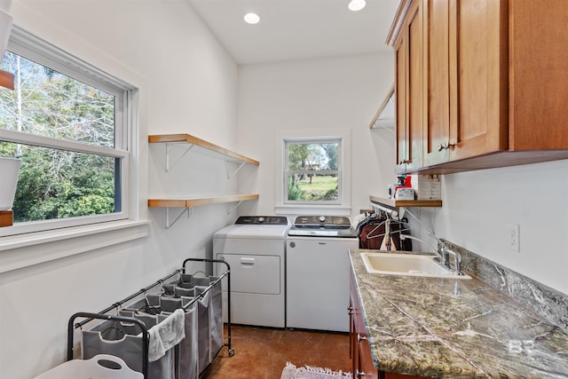 washroom with washer and dryer, recessed lighting, cabinet space, and a sink