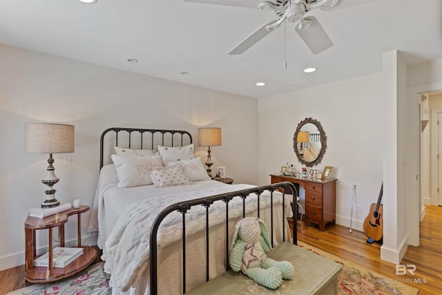 bedroom with recessed lighting, baseboards, light wood-style flooring, and a ceiling fan