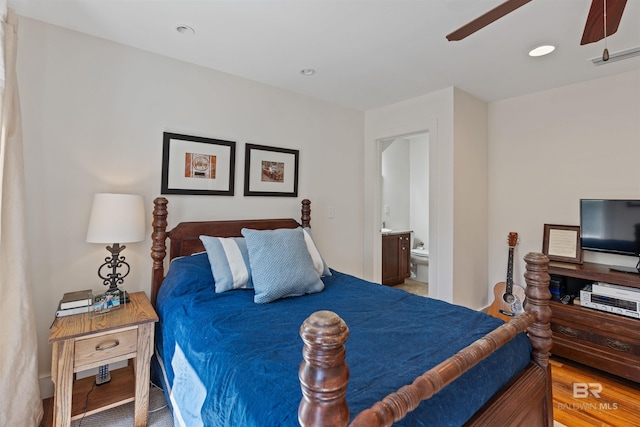 bedroom with ceiling fan, ensuite bath, recessed lighting, and light wood finished floors