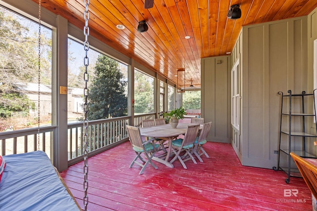 sunroom / solarium featuring wood ceiling