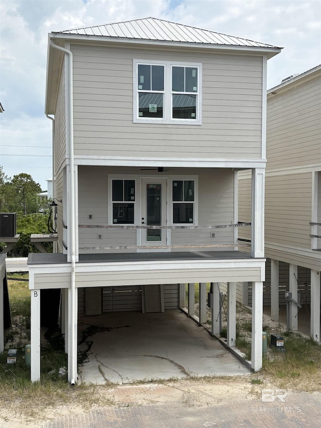 raised beach house with metal roof