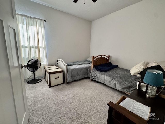 carpeted bedroom featuring a ceiling fan