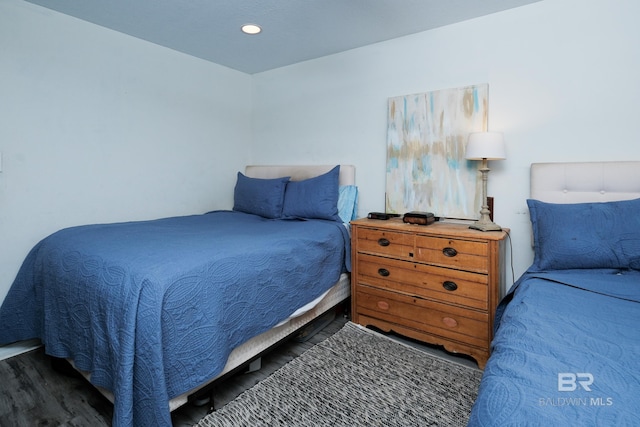 bedroom featuring dark hardwood / wood-style floors