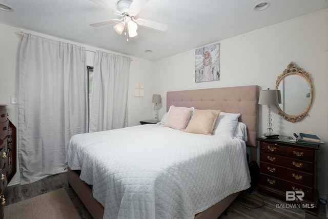 bedroom featuring wood-type flooring and ceiling fan