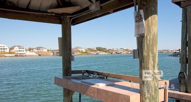 view of dock featuring sink and a water view