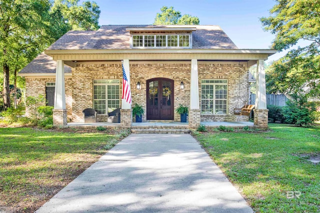 view of front facade featuring a porch and a front yard