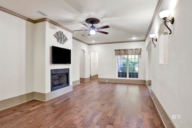 unfurnished living room with ornamental molding, ceiling fan, and hardwood / wood-style floors