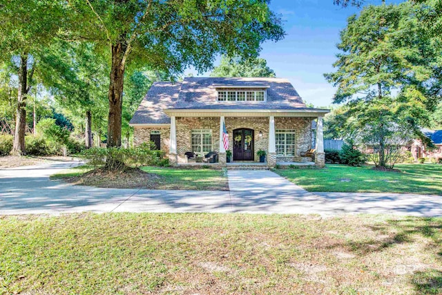 view of front of home featuring a porch and a front yard