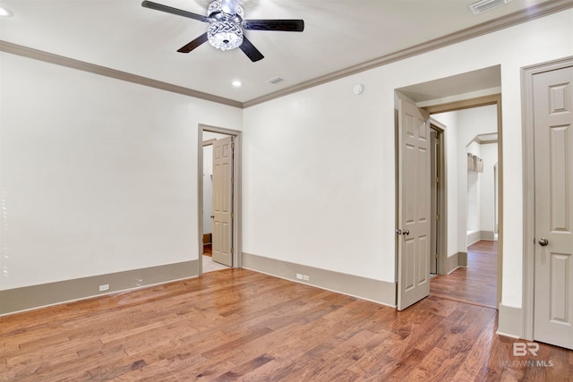 unfurnished room featuring ornamental molding, ceiling fan, and hardwood / wood-style floors