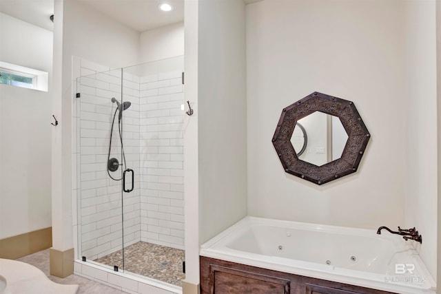 bathroom with tile patterned flooring and plus walk in shower