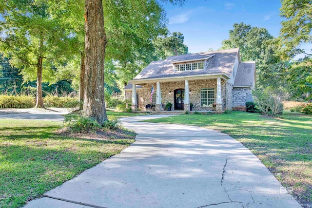 view of front of property with a porch and a front yard