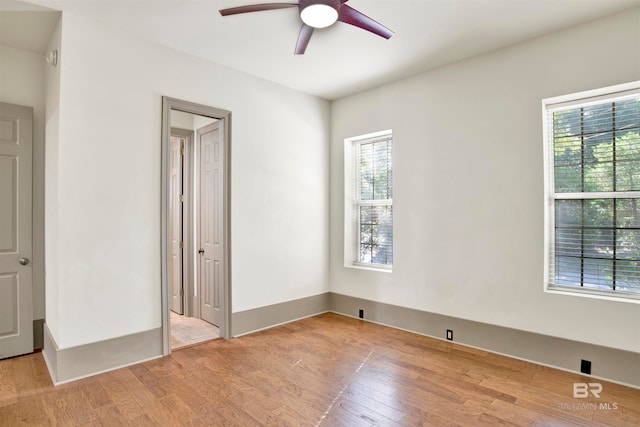 unfurnished bedroom with light hardwood / wood-style floors and ceiling fan