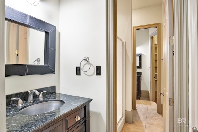 bathroom with vanity and tile patterned flooring