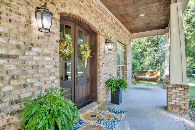 doorway to property with a porch