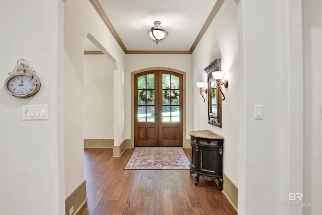 entryway with crown molding, french doors, and hardwood / wood-style floors