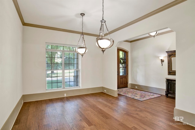 entryway featuring crown molding and hardwood / wood-style flooring