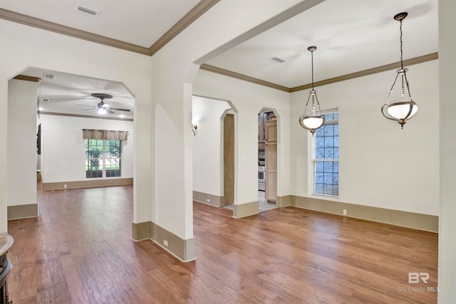 entrance foyer featuring hardwood / wood-style flooring, crown molding, and ceiling fan