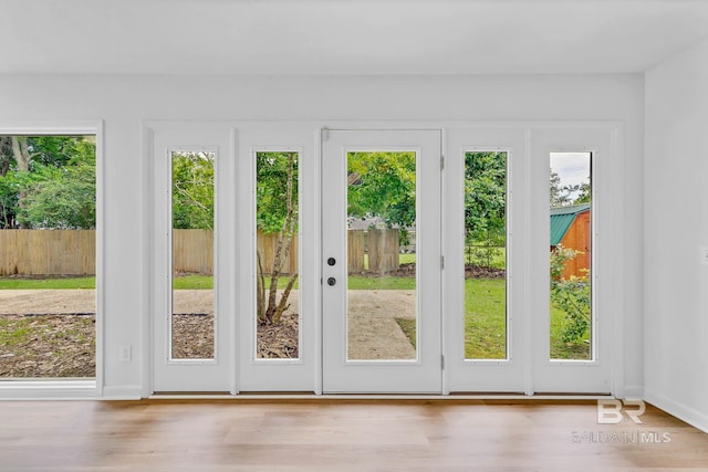 18 Rollins Pl, Atmore, AL 36502 - doorway to outside with wood finished floors and baseboards
