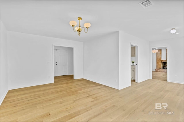 18 Rollins Pl, Atmore, AL 36502 - spare room with a chandelier and light wood finished floors