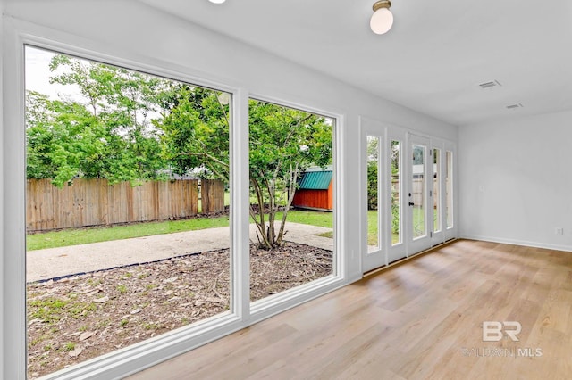 18 Rollins Pl, Atmore, AL 36502 - unfurnished sunroom featuring french doors and healthy amount of natural light