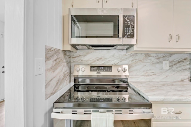 18 Rollins Pl, Atmore, AL 36502 - kitchen featuring appliances with stainless steel finishes and decorative backsplash