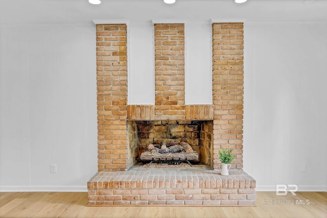 18 Rollins Pl, Atmore, AL 36502 - detailed view of wood finished floors, recessed lighting, and a fireplace