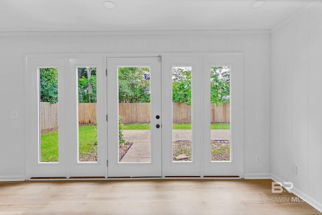 18 Rollins Pl, Atmore, AL 36502 - doorway to outside with crown molding and wood finished floors
