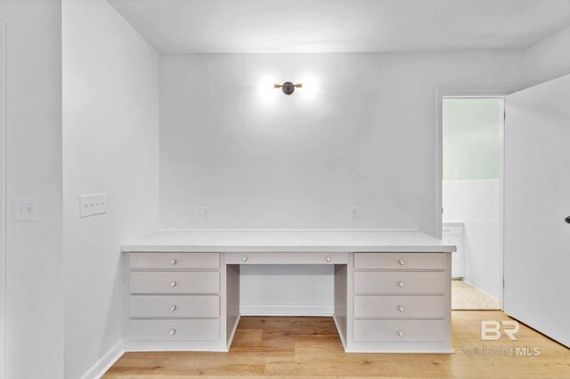 18 Rollins Pl, Atmore, AL 36502 - unfurnished office with built in desk and light wood finished floors