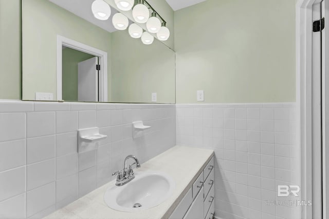 18 Rollins Pl, Atmore, AL 36502 - bathroom with tile walls, vanity, and wainscoting