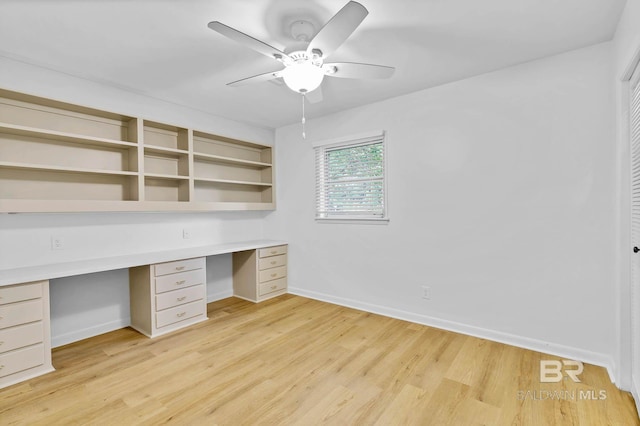 18 Rollins Pl, Atmore, AL 36502 - unfurnished office with built in desk, ceiling fan, and light wood-type flooring