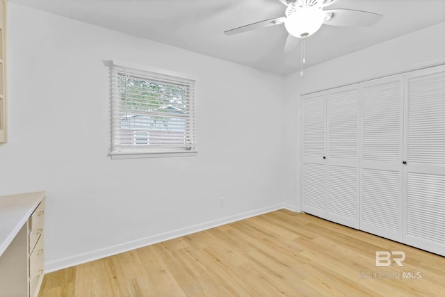18 Rollins Pl, Atmore, AL 36502 - unfurnished bedroom featuring light wood finished floors, a closet, and ceiling fan