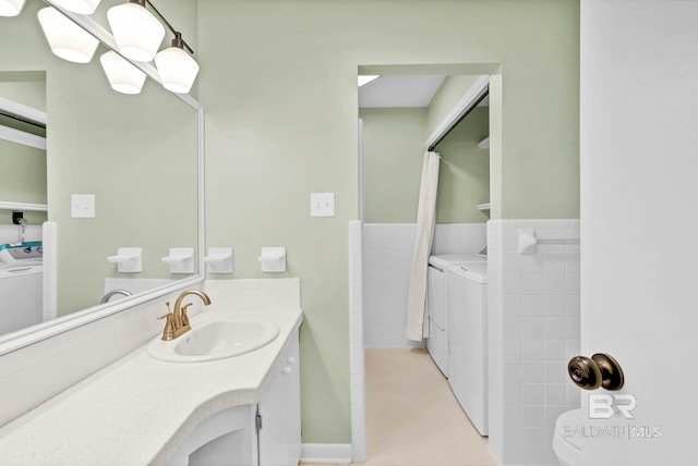 18 Rollins Pl, Atmore, AL 36502 - bathroom with independent washer and dryer and vanity