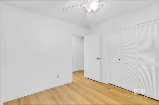 18 Rollins Pl, Atmore, AL 36502 - unfurnished bedroom featuring wood finished floors, a closet, and a ceiling fan