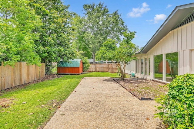 18 Rollins Pl, Atmore, AL 36502 - fenced backyard featuring a storage shed and a patio area