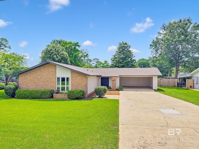 18 Rollins Pl, Atmore, AL 36502 - mid-century inspired home with concrete driveway, brick siding, and an attached garage