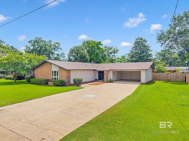 18 Rollins Pl, Atmore, AL 36502 - view of front of house featuring concrete driveway, brick siding, roof with shingles, and a carport