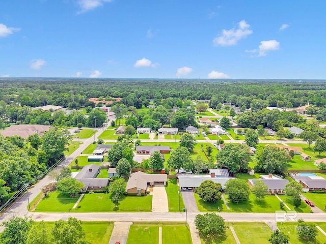 18 Rollins Pl, Atmore, AL 36502 - aerial perspective of suburban area featuring a heavily wooded area