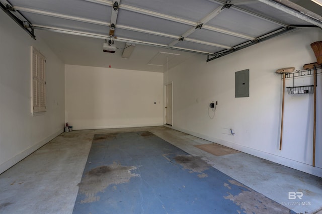 garage featuring electric panel and a garage door opener