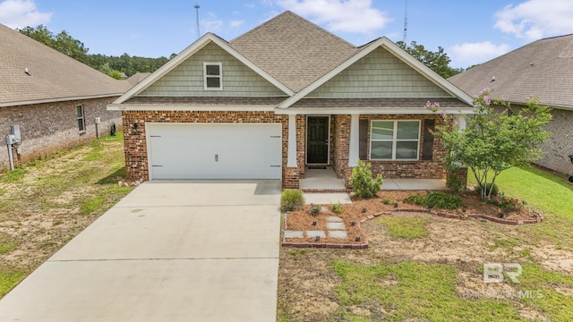 31689 Kestrel Loop, Spanish Fort, AL 36527 - craftsman-style house featuring roof with shingles, driveway, a garage, brick siding, and a front lawn