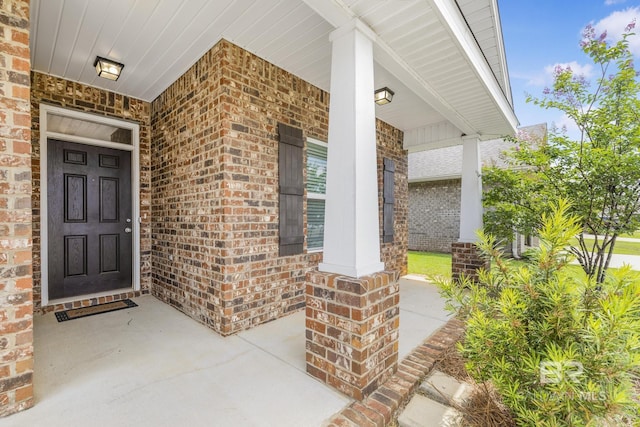 31689 Kestrel Loop, Spanish Fort, AL 36527 - doorway to property with a porch and brick siding