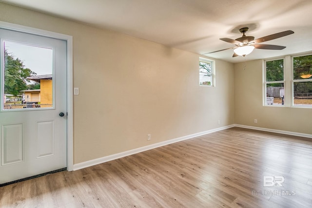 unfurnished room featuring ceiling fan and light hardwood / wood-style flooring