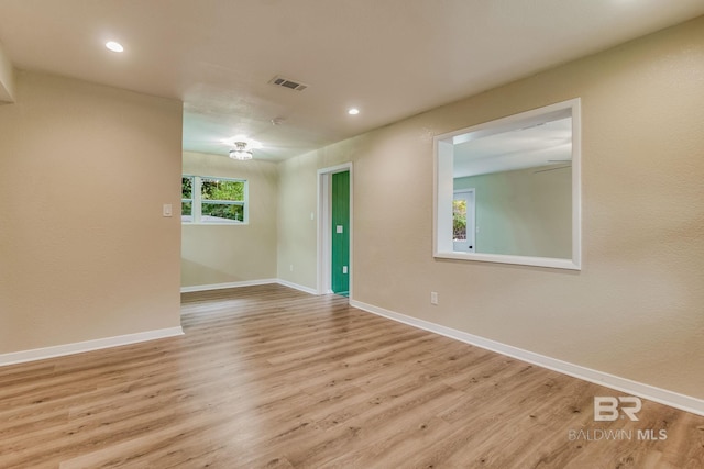 unfurnished room featuring light hardwood / wood-style flooring