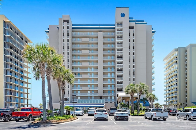 view of building exterior featuring uncovered parking