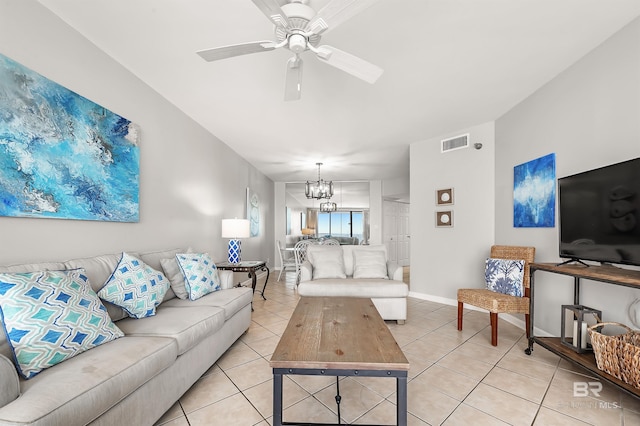 living room featuring light tile patterned floors, ceiling fan with notable chandelier, visible vents, and baseboards