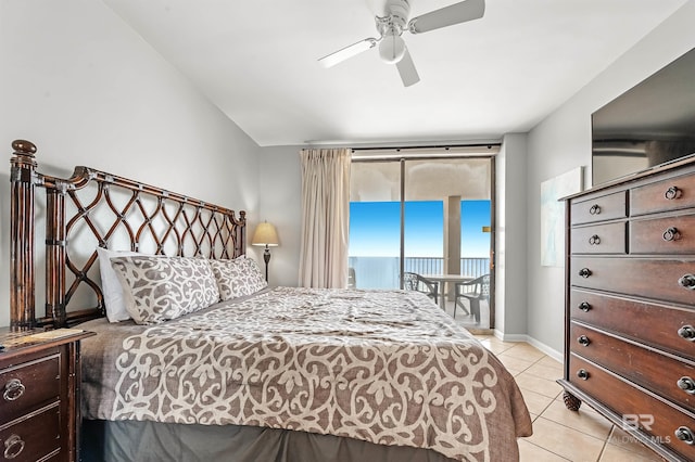 bedroom featuring light tile patterned floors, ceiling fan, baseboards, and access to exterior