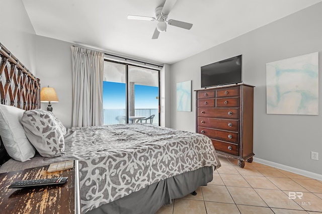 bedroom with light tile patterned floors, baseboards, a ceiling fan, and access to exterior